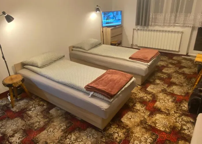 בית אירוח Pokoje Goscinne Pod Lasem